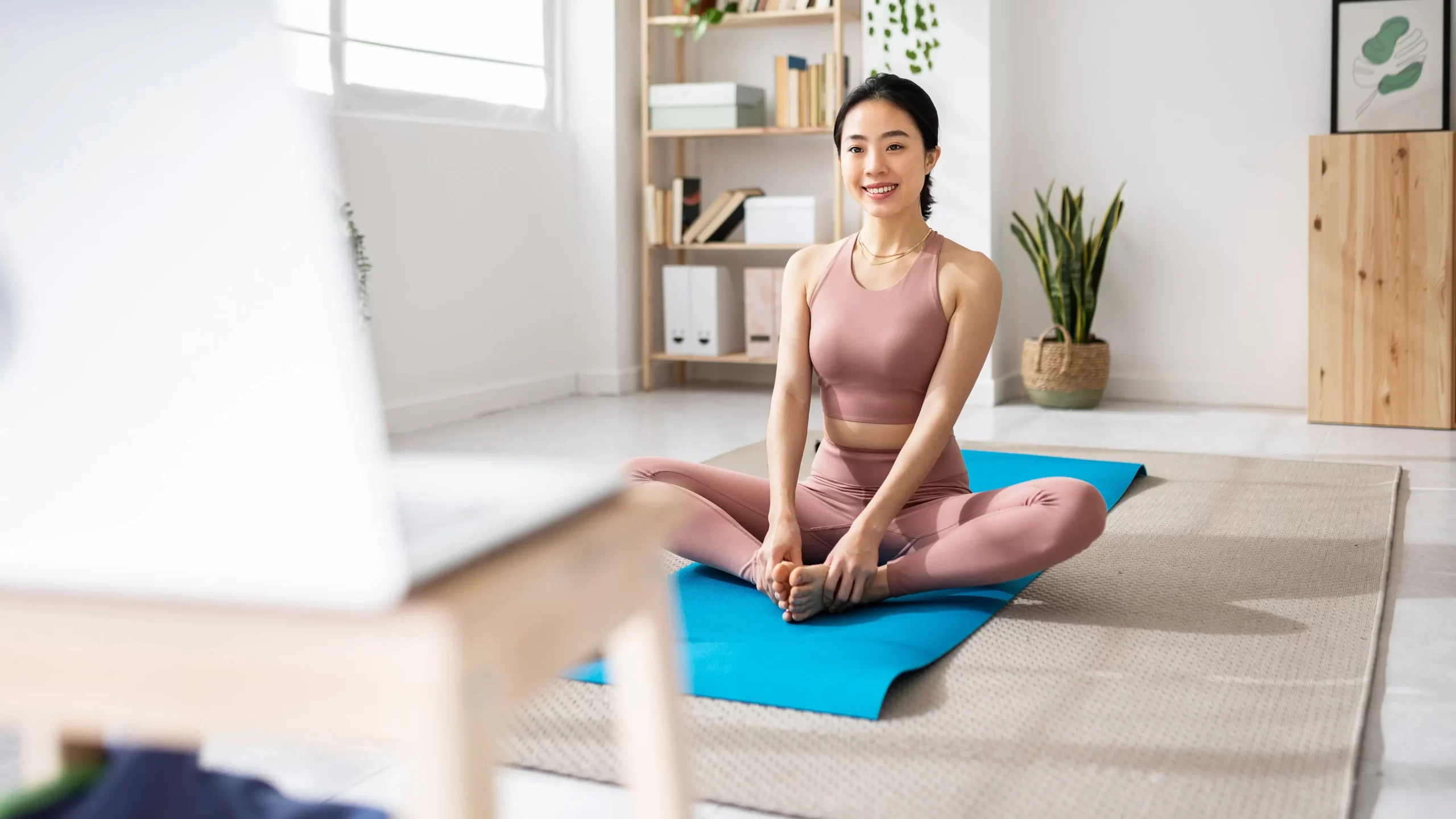 A woman recording herself about to do yoga